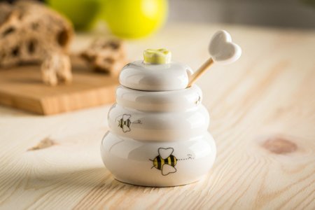 Porcelain honey pot with wooden dipper