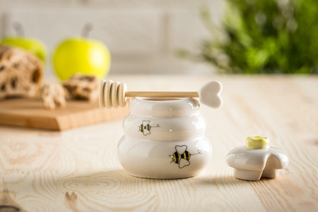 Porcelain honey pot with wooden dipper