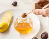 Hexagon honey jar with wooden dipper