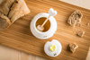 Porcelain honey pot with wooden dipper